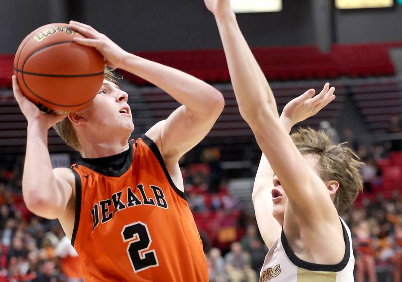 DeKalb's Sean Reynolds shoots over Sycamore's Aidan Wyzard during the First National Challenge Friday, Jan. 27, 2023, at The Convocation Center on the campus of Northern Illinois University in DeKalb.