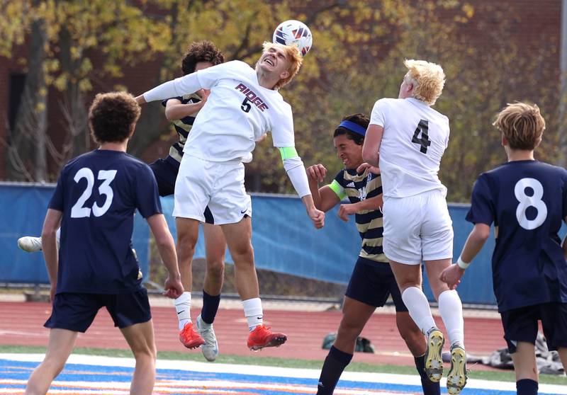 Prairie Ridge's Brandon Matei heads the ball away from Lemont players in front of his goal Saturday, Nov. 9, 2024, during their Class 2A state third place game at Hoffman Estates High School.