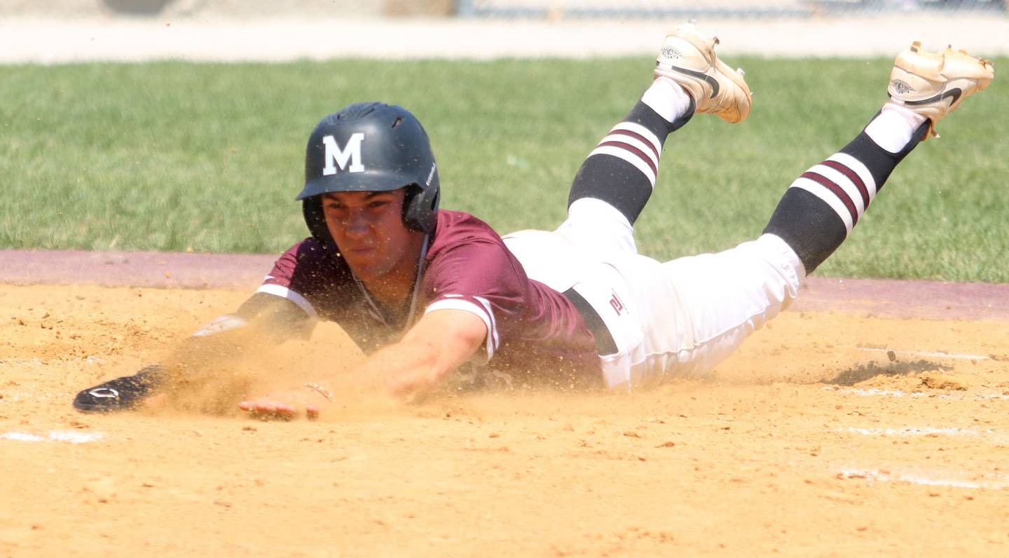 Marengo’s Robert Heuser skids across home to score against Rockford Christian in IHSA Class 2A Regional Title Game action baseball at Richmond-Burton High School in Richmond  on Saturday, May 24, 2025.
