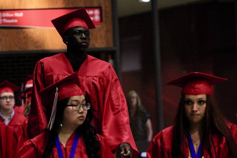 Sauk Valley Community College graduates file through Dillon Mall prior to commencement on Friday, May 12, 2023.