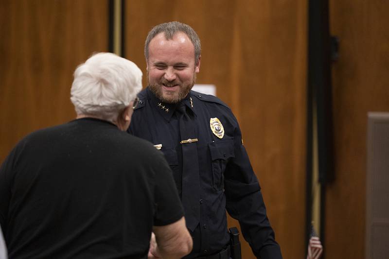 Rock Falls Police Chief Ryan McKanna shakes hands with Mayor Rod Kleckler after being sworn in on Tuesday, Dec. 16, 2025.