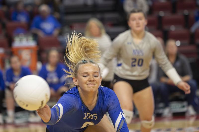 Newman’s Jess Johns dives for a ball Friday, Nov. 11, 2022 in a class 1A volleyball semifinal against Aquin.
