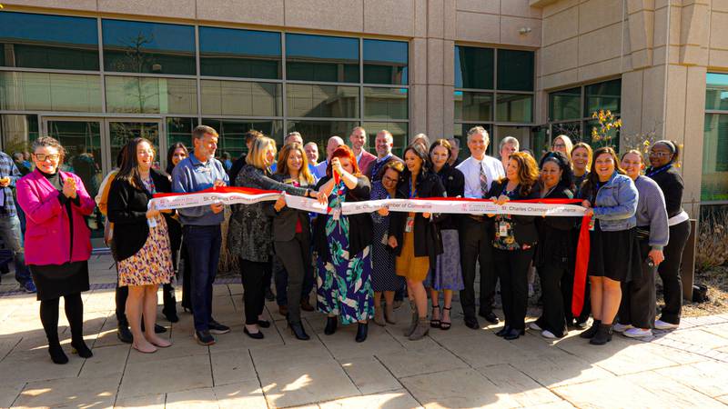 Recovery Centers of America staff cut the ribbon at their new outpatient facility at 300 Cardinal Drive in St. Charles on Thursday, April 25, 2024.