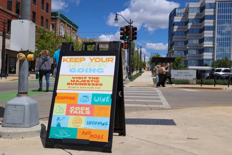 A sign informs marketgoers about other downtown Kankakee businesses during the Kankakee Farmers' Market of the year on May 1, 2026.