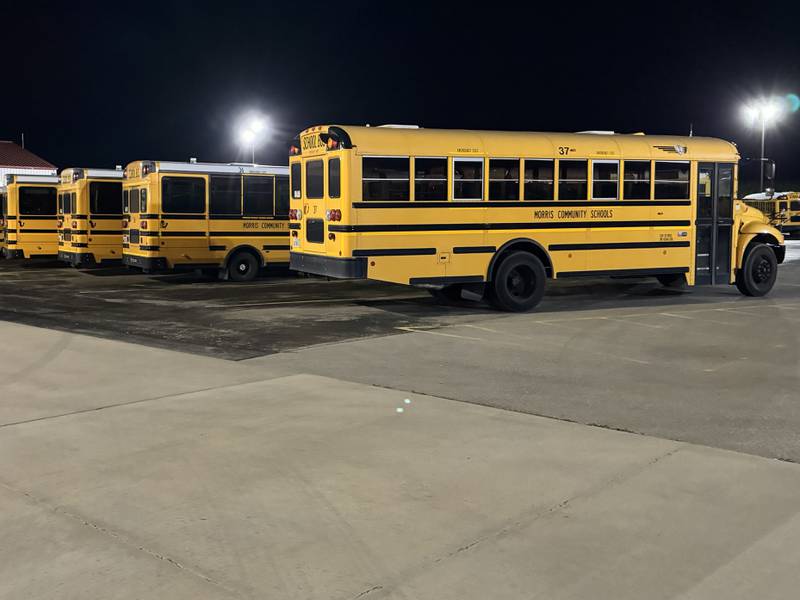 School buses outside of Saratoga School on Wednesday night, when the Saratoga Elementary School Board was discussing whether or not it should contract out bus services.
