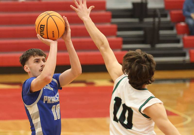 Princeton's Gavin Lanham shoots a jump shot over Eureka's Teagan McLaughin during the Colmone Classic on Thursday, Dec. 11, 2025 at Hall High School.