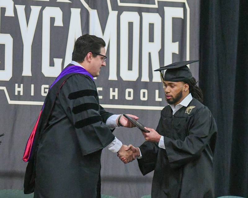 Sycamore High School senior Omarion Bibbs receives his diploma on Sunday, May 25, 2025, during the Class of 2025 Commencement ceremony at the high school.