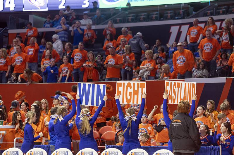 Eastland fans celebrate the Cougar’s win over Peoria  Christian Thursday, March 13, 2025, during the Class 1A boys basketball state semifinal.
