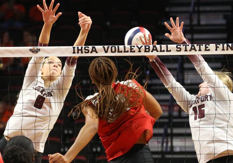 Lockport's Kyla Mitchell and teammate Quinn Higham miss a kill from Marist's Cassidy Cage during the Class 4A State semifinal game on Friday, Nov. 15, 2024 at CEFCU Arena in Normal.