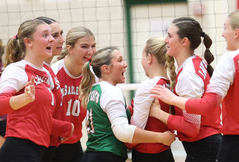 Members of the L-P volleyball team react after winning the opening set against Morris during the Class 3A Sectional semifinal game on Tuesday, Nov. 4, 2025 in Sellett Gymnasium at L-P High School.