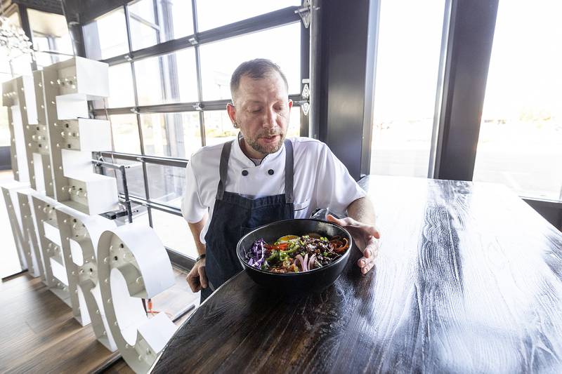 Chef Garrett Volz unveils a ramen dish which will be served at the Mercantile.
