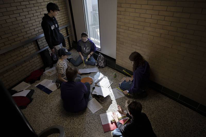 Light streams through a window at Rock Falls High School as students from Rochelle High School practice for a performance Sunday, Feb. 26, 2023. The group was attending the ninth annual Percussion Palooza at the school.