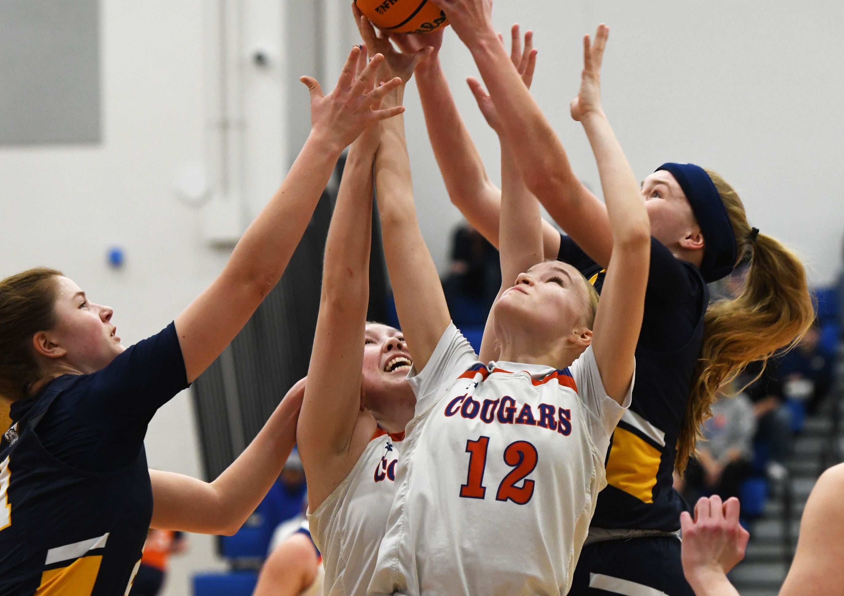 Eastland's Celeste Lower (12) battles Polo's Camrynn Jones (right) and Avalyn Henry (left) for a rebound on Tuesday, Feb. 10, 2026 at Eastland High School in Lanark.