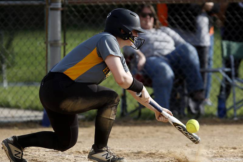Harvard’s Allie Scott tries to get down a bunt during a nonconference softball game against Crystal Lake Central Monday, May 15, 2023, at Crystal Lake Central High School.