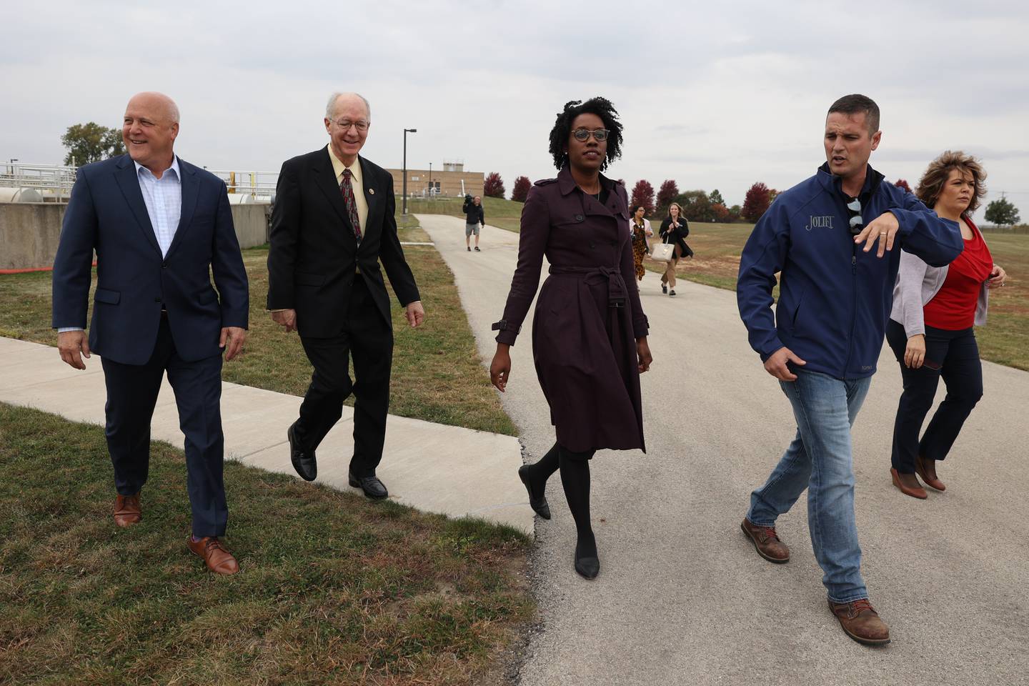 Senior Advisor to the President and White House Infrastructure Coordinator, Mitch Landrieu, left, Congressman Bill Foster and Congresswoman Lauren Underwood get a tour of the City of Joliet Aux Sable Wastewater Treatment Plant by Nick Gornick, Deputy Director of Plant Operations, during a press conference announcing new funding from the Bipartisan Infrastructure Law for the state of Illinois on Tuesday.