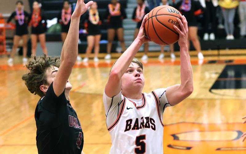 DeKalb's Tyler Vilet goes to the basket in front of a Dunlap defender during their game Monday, Nov. 21, 2022, at DeKalb High School.