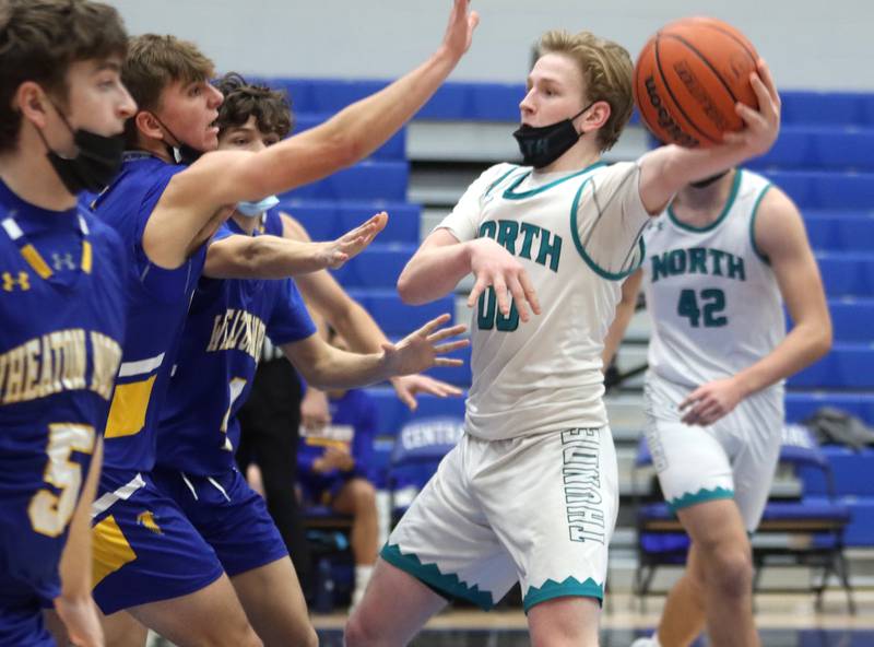 Woodstock North’s Rex White moves the ball against Wheaton North during MLK Tournament action at Burlington Central High School Saturday morning.