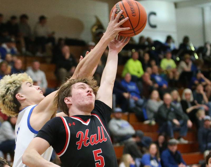 Princeton's Landon Roark and Hall's Caleb Bickett jump for a rebound on Friday, Jan. 26, 2024 at Princeton High School.