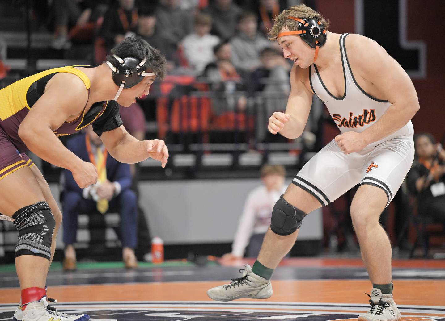 St. Charles East’s Cooper Murray battles Loyola’s Kai Calcutt in teh class 3A 215-pound bout at the boys IHSA wrestling finals at State Farm Center in Champaign on Saturday, Feb. 21, 2026.