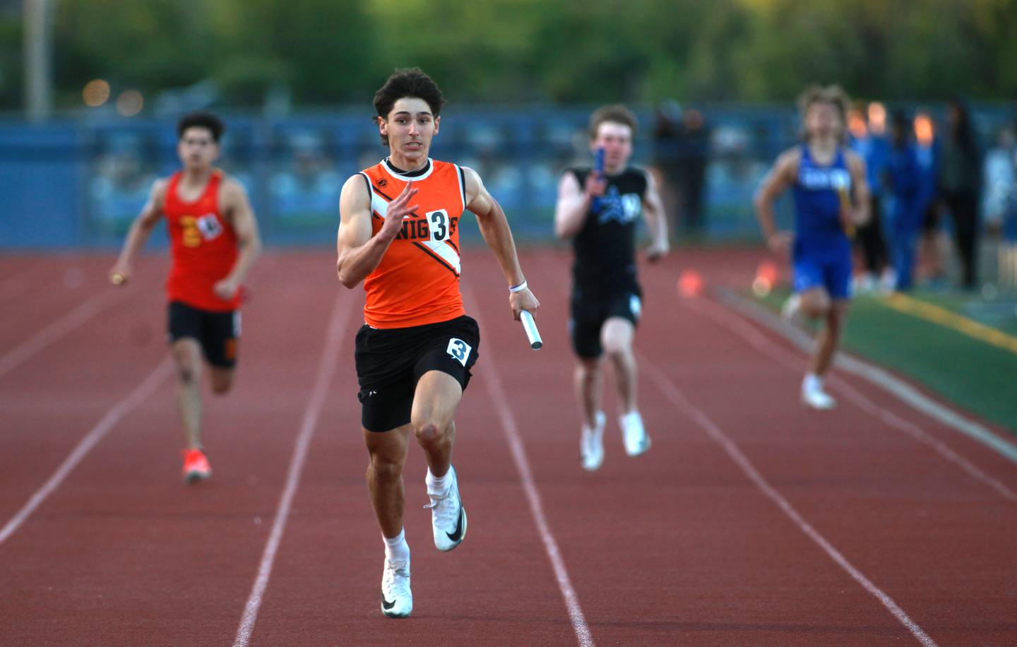 Kaneland’s Luke Gadomski runs the anchor leg of the 4x200-meter relay during the Kane County boys track and field championships on Friday, May 9, 2025 at St. Charles North.