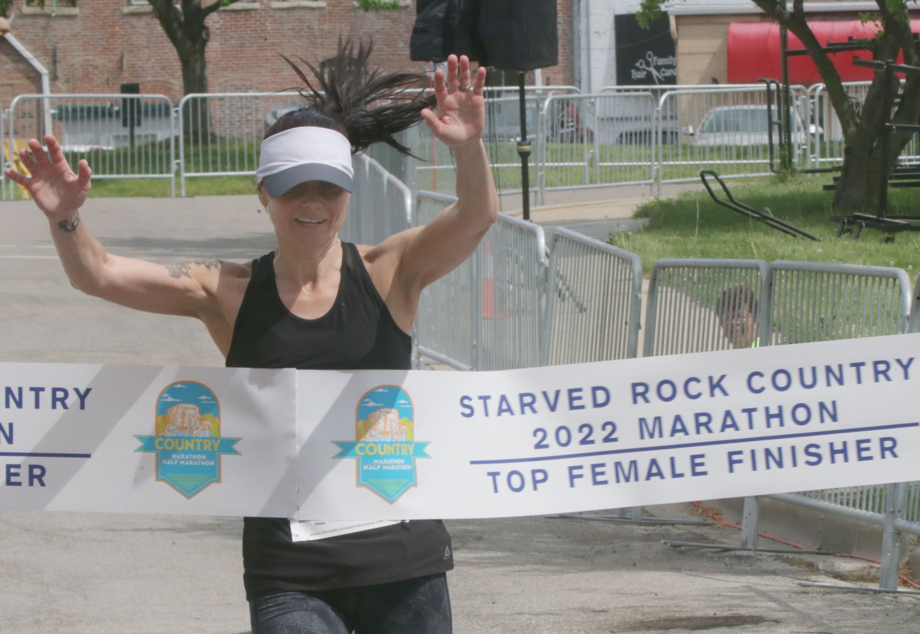Angie Lampi of Dexter, Mich., is the top female finisher as she crosses the finish line during the Starved Rock Marathon on Saturday, May 14, 2022, in Ottawa.