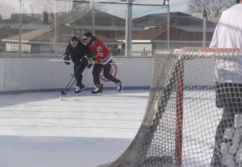 People including Mark Kulach of Burbank and Alan Zasavny of Burbank participate in Stick & Puck at the Bobby Hull Community Ice Rink Sunday, Jan. 26, 2025 in Cicero.