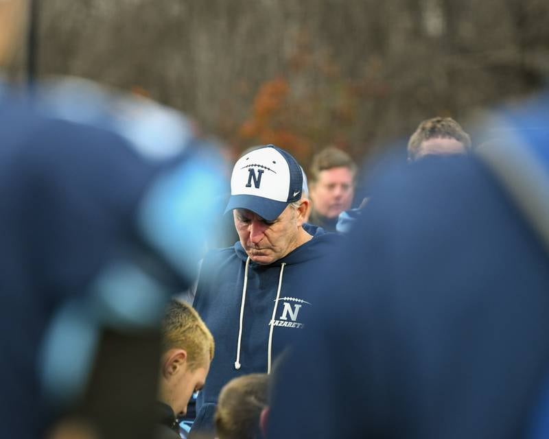 Nazareth Academy's head coach Tim Racki talks with the team after falling short in overtime to Fenwick during the 6A semifinals game on Saturday Nov. 22, 2025, held at Nazareth Academy High School in La Grange Park.