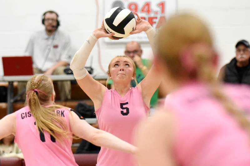 Cissna Park's Mady Marcott, center, sets the ball as Sophie Duis, left, and Addison Lucht prepare to strike during a game at Watseka Tuesday, Oct. 21, 2025.