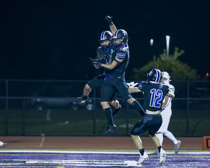 Downers Grove North's Oliver Thulin (10) celebrates a touchdown during football game between York at Downers Grove North.  Sept 29, 2023.