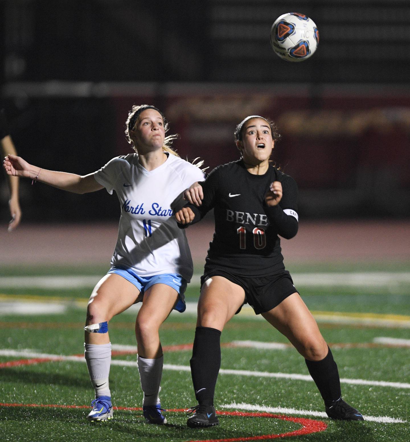 John Starks/jstarks@dailyherald.com
Benet Academy’s Mariana Pinto and St. Charles North’s Sidney Timms compete for the ball in the Naperville Invitational girls soccer tournament on Friday, April 22, 2022. They both scored a goal in regulation time.