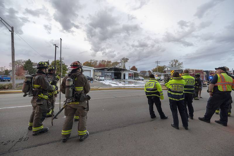 First responders gather outside of C&K Undercar Specialists in Sterling Friday, Nov. 7, 2025, while responding to a fire at the location.