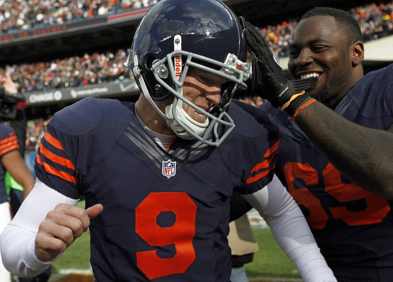 Chicago Bears kicker Robbie Gould (9) celebrates his game-winning field goal against the Carolina Panthers with teammate Henry Melton at Soldier Field in Chicago, Illinois, Sunday, October 28, 2012. The Bears defeated the Panthers, 23-22.