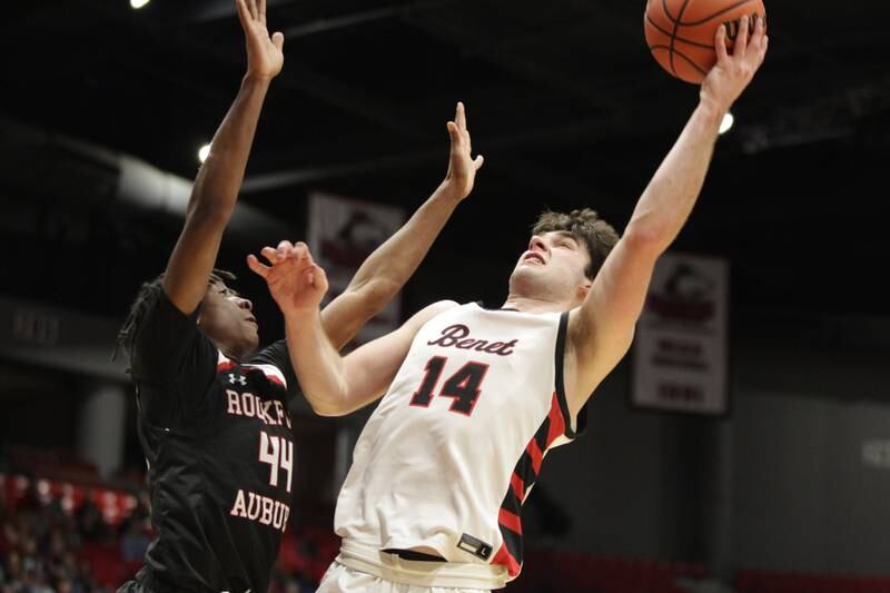 Benet’s Parker Sulaver (right) goes up for a shot against Rockford Auburn’s Amir Danforth during the Class 4A NIU Supersectional in DeKalb on Monday, March 6, 2023.