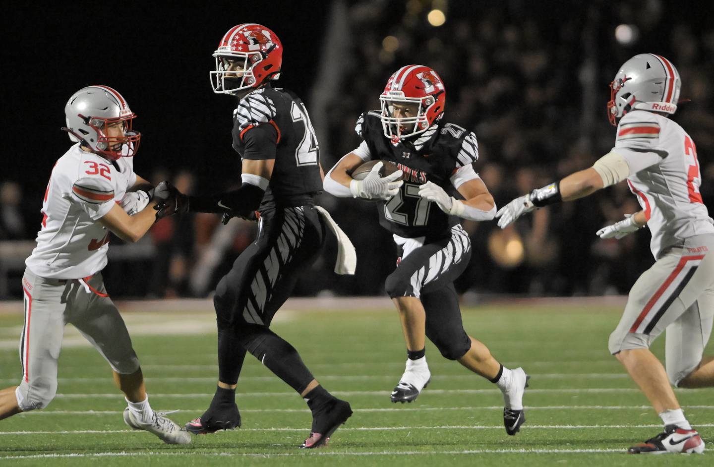 Maine South’s Niko Kokosioulis makes a cut through the hole aginst Palatine in a football game in Park Ridge on Friday, Sept. 12, 2025.