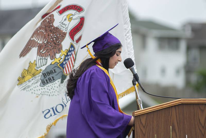 Class of 2022 valedictorian Mariam Sohail reads her speech Sunday during Dixon High School’s graduation.