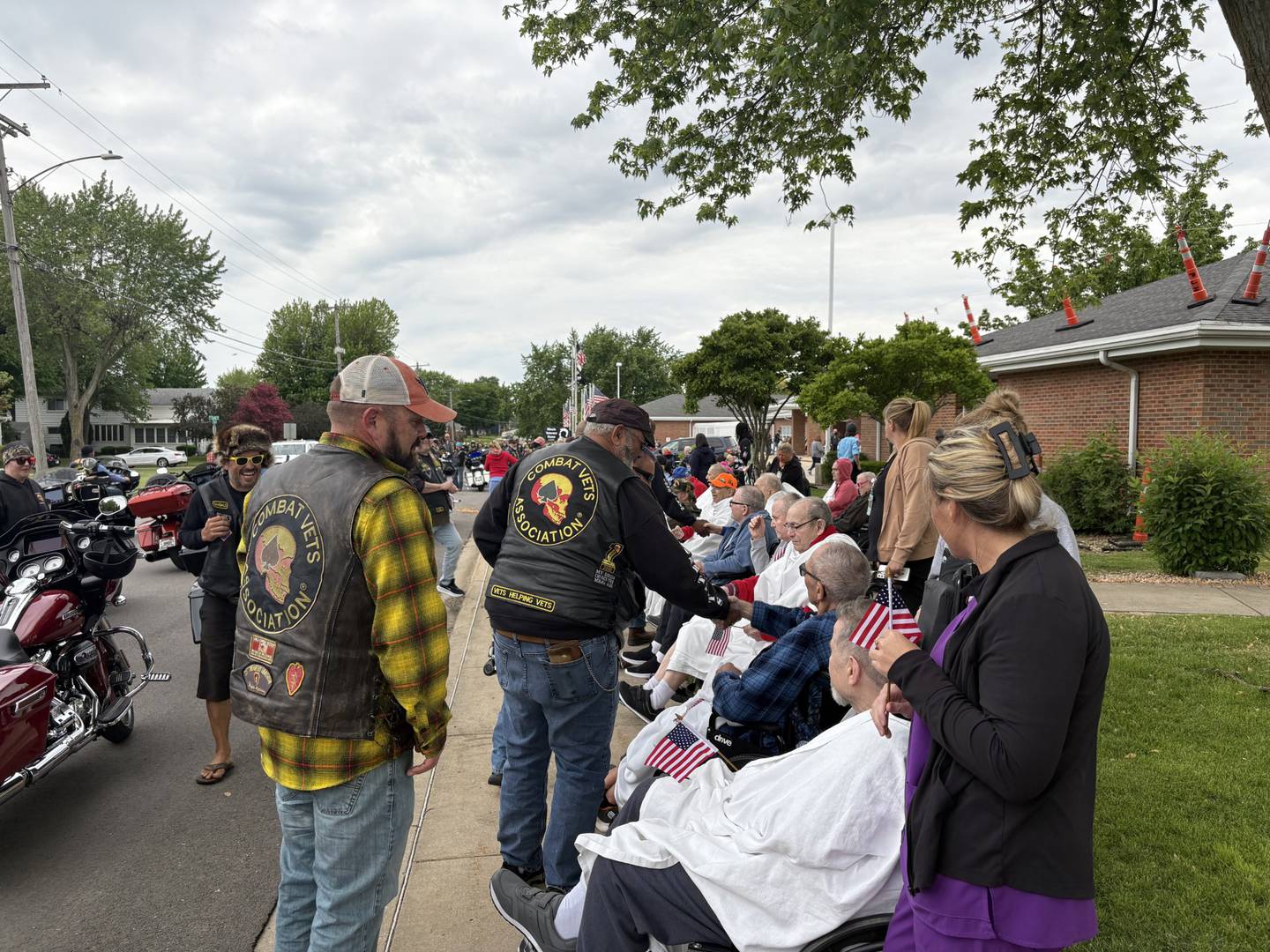 Members of the Combat Veterans Motorcycle Association greet residents at the Illinois Veterans Home in La Salle during their Memorial Day weekend ride on Saturday, May 24, 2025.