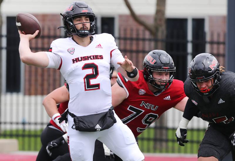 Northern Illinois quarterback Ethan Hampton escapes pressure to throw a pass during the Spring Showcase Saturday, April 22, 2023, at Huskie Stadium at NIU in DeKalb.