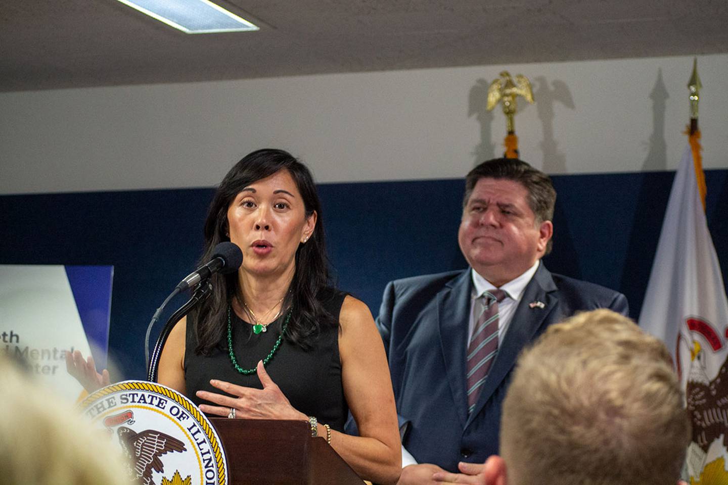 Illinois Deputy Governor for Health and Human Services Grace Hou appears alongside Gov. JB Pritzker at a Springfield news conference in 2023.