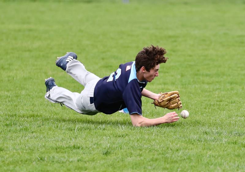 Bureau Valley outfielder Cooper Balensiefen makes a dive for a fly Monday at Princeton.
