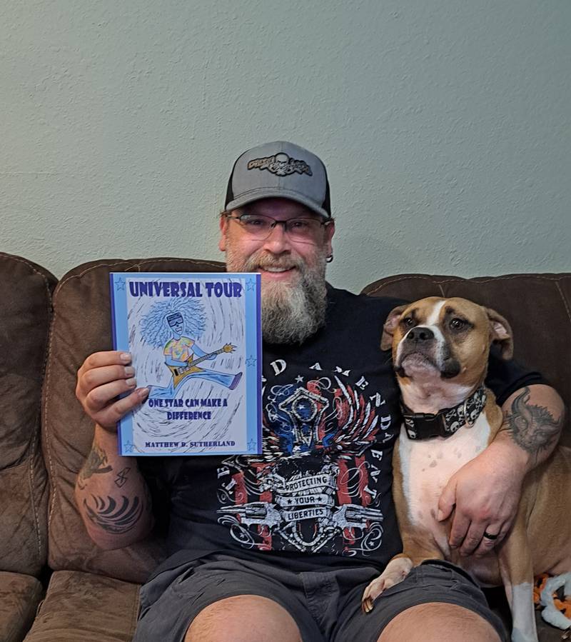 Matthew Sutherland of Rock Falls holds up his sixth and newest book release.