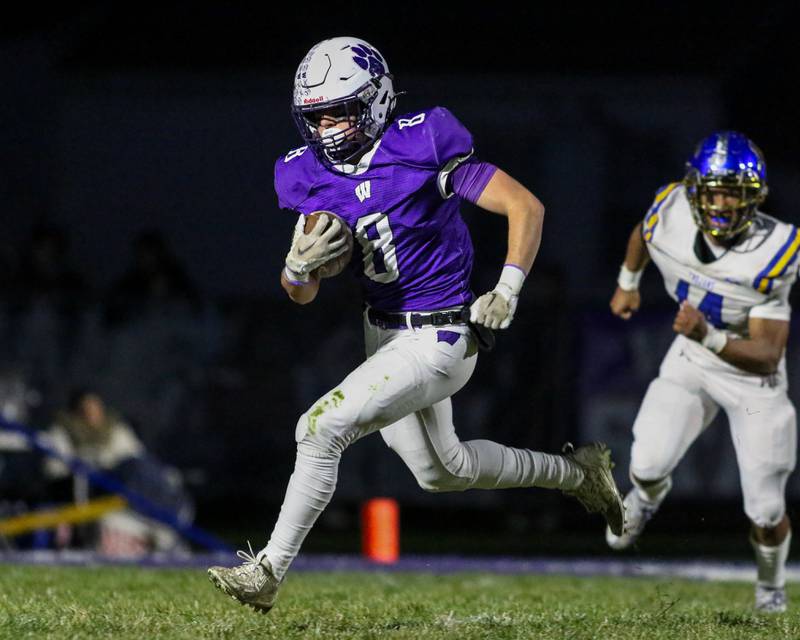 Wilmington's Kyle Farrell (8) runs towards the sidelines during Class 2A semi-final playoff football game between Moroa-Forsyth at Wimington.  Nov 18, 2023.