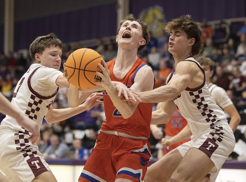 Eastland’s Wyatt Carroll is fouled by Tremont’s Josh Papenhause Monday, March 9, 2026, in the Class 1A Macomb Supersectional.