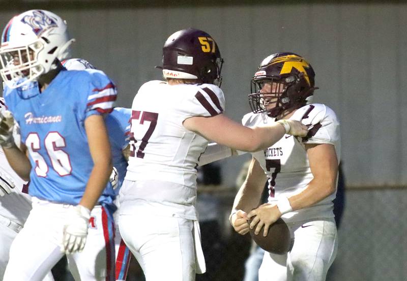 Richmond-Burton’s Blake Livdahl, right, is greeted by Mason Lowry, center, in the end zone after scoring a touchdown against Marian Central in varsity football at George Harding Field on the campus of Marian Central High School in Woodstock on Friday, August 29, 2025.