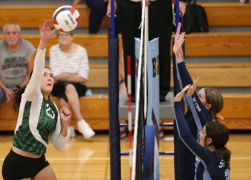 St. Bede's Ali Bosnich spikes the ball past Bureau Valley defenders on Tuesday, Sept. 5, 2023 at Bureau Valley High School.