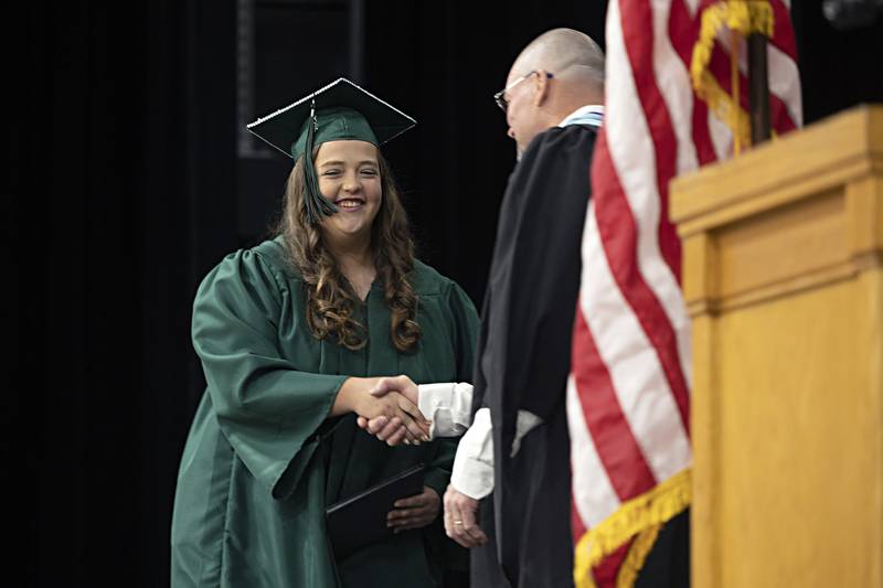 Brooklyn Leopard-Korstick receives her diploma Sunday, May 28, 2023 at Rock Falls High School’s 144th commencement ceremony.