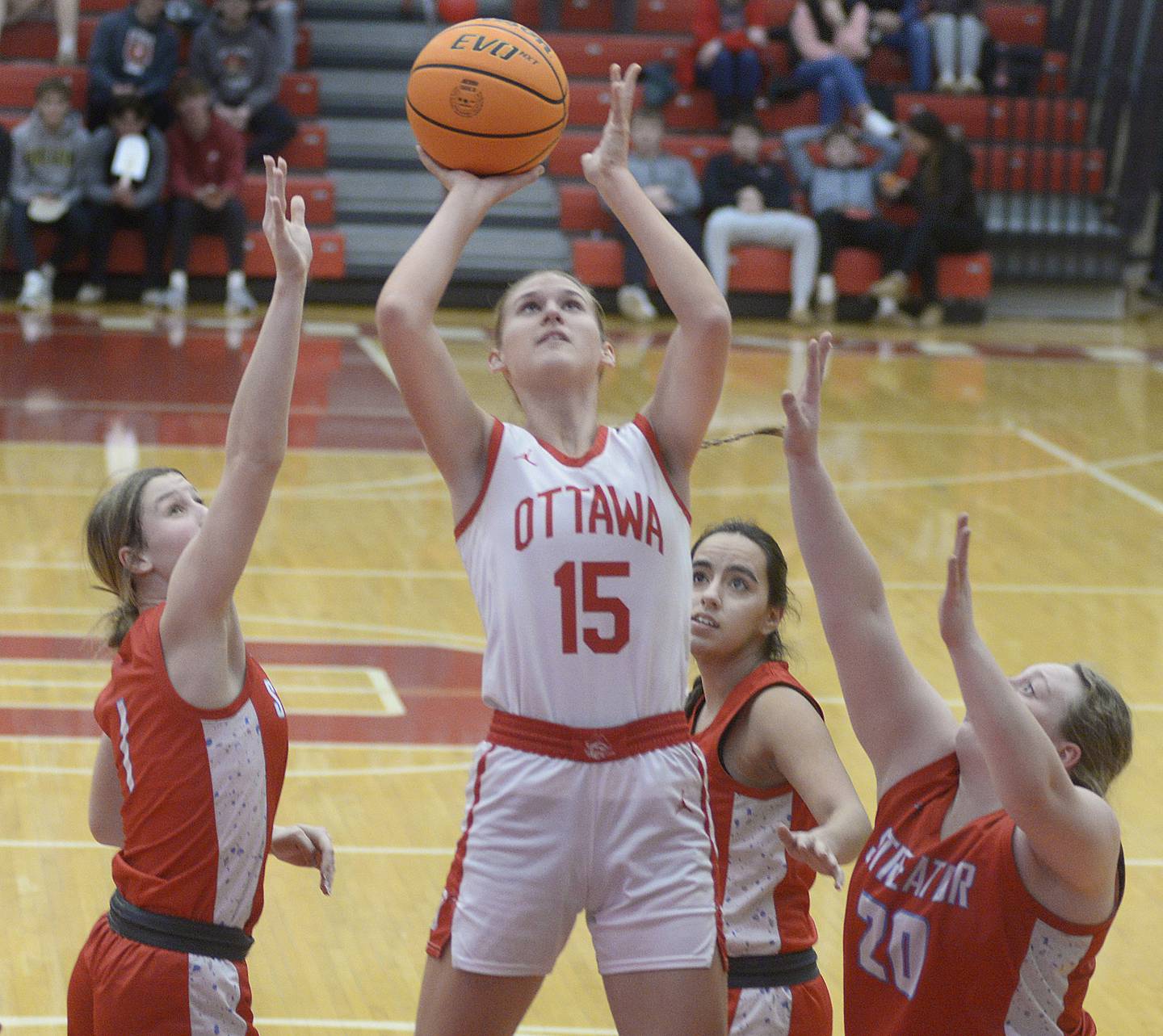 Ottawa’s Hailey Larsen shoots ahead of the block attempts by Streator’s Rhea Huey and Maddy Martin in the 2nd period Thursday at Ottawa.