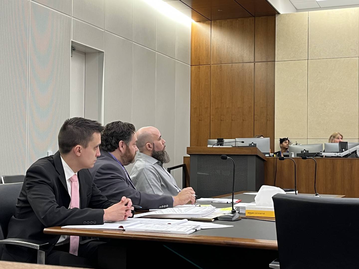 Defense attorneys Zack Strupeck (left) and Phil Villasenor sit with their client, Jermaine Mandley, 47, of Bolingbrook, in a courtroom during a trial on Wednesday, Aug. 16, 2023. Mandley faces charges of shooting and killing Maya Smith on Jan. 7, 2023.