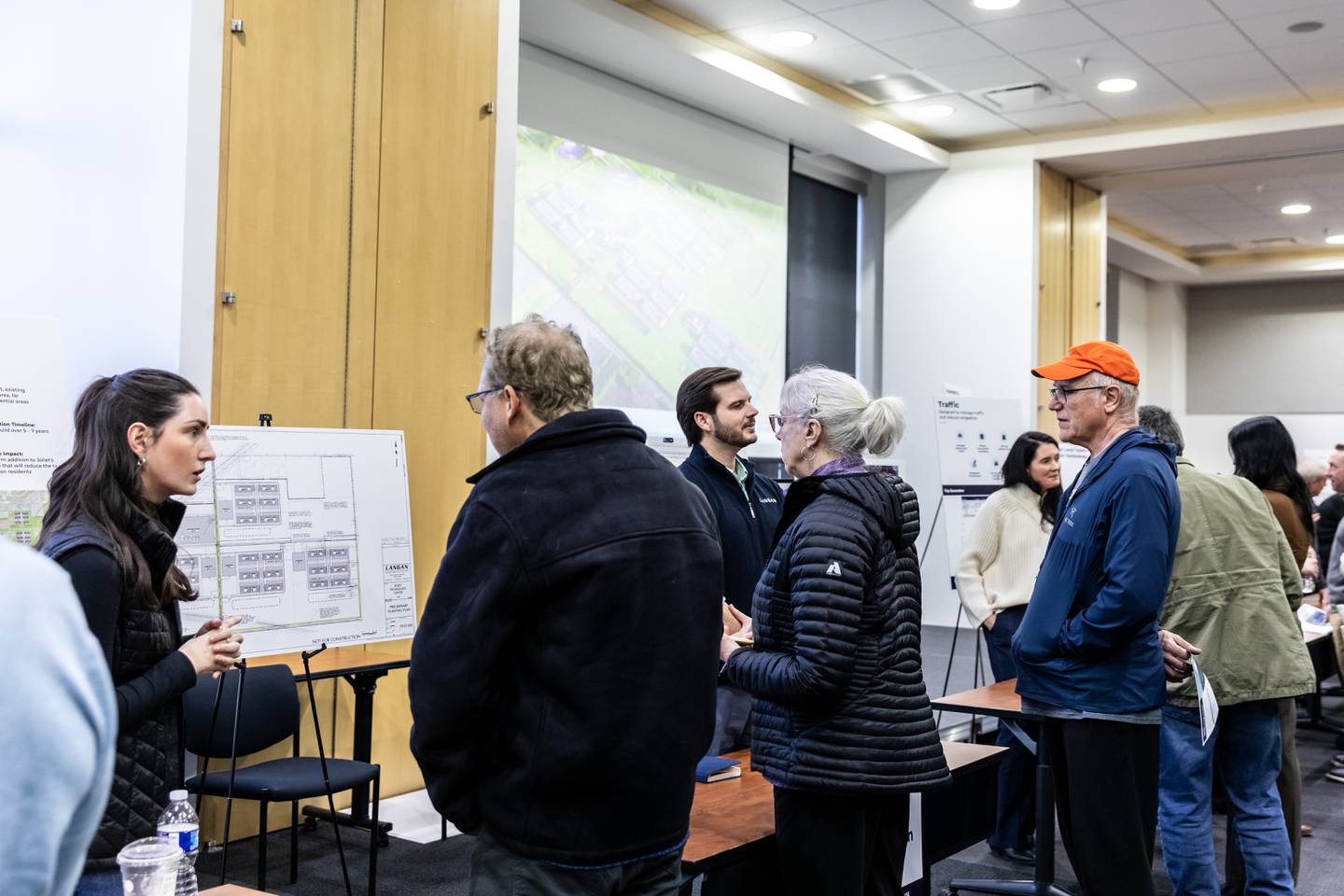 Members of the community talk with representatives from the proposed Joliet Technology Center during an open house event at Joliet Community College on Feb. 12, 2026.