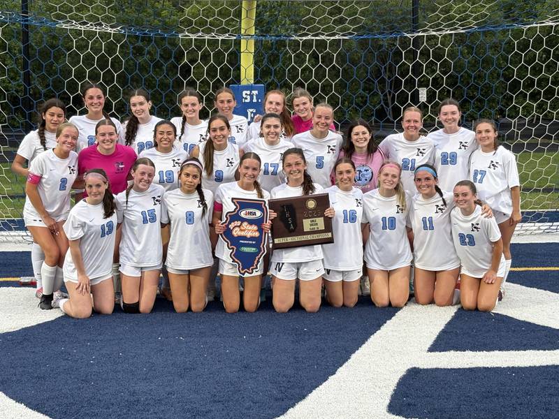 The Nazareth soccer team poses with the supersectional plaque after winning the Class 2A St. Francis Supersectional on Tuesday in Wheaton.