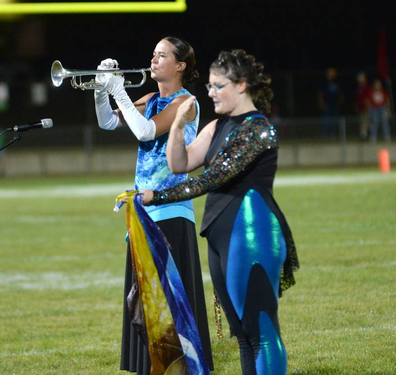 Oregon High School marching band member Sarah Eckardt plays the trumpet as Paige Oltmann performs during halftime of the football game with Rock Falls on Friday, Sept. 19, 2025.